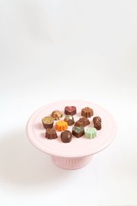 Close-up of food on table against white background