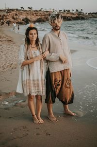 Full length of woman standing on beach