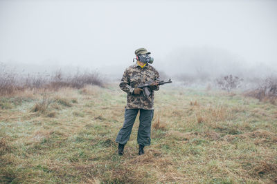 Full length of man standing on field