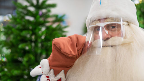 Portrait of russian santa claus in a protective visor