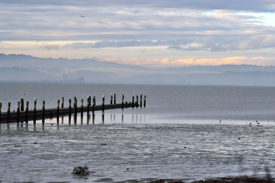 Scenic view of sea against sky during sunset