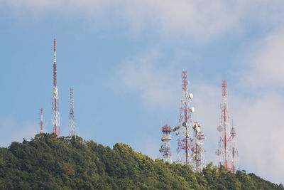 Low angle view of communications tower against sky