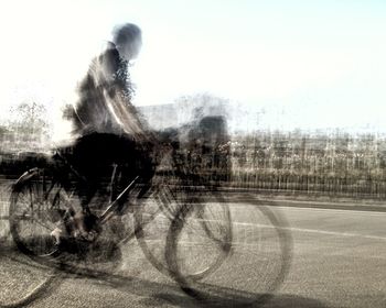 Blurred motion of people walking on road