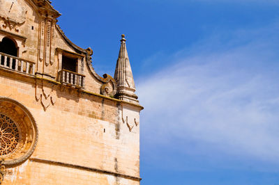 Low angle view of building against blue sky