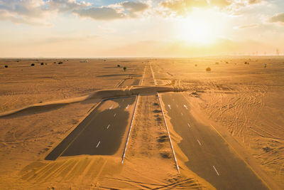 Scenic view of road against sky during sunset