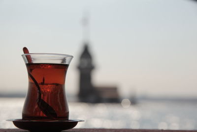 Close-up of drink in jar against sky