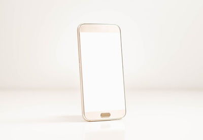 Close-up of smart phone against white background
