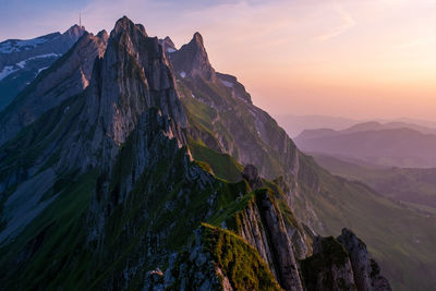 Panoramic view of mountain range against sky during sunset