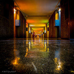 Wet empty corridor at night