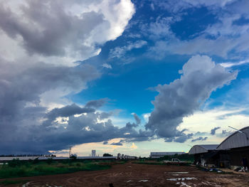 Panoramic view of land and buildings against sky