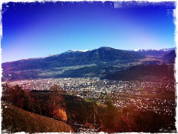 Scenic view of mountains against clear blue sky