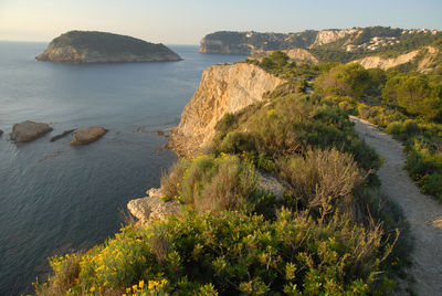 Scenic view of sea by cliff