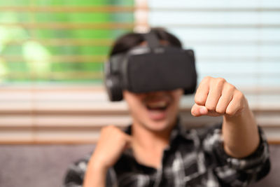 Portrait of young woman standing outdoors