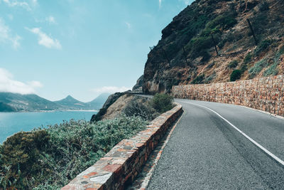 Road by sea against sky