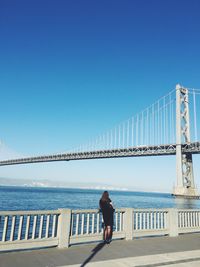 Man standing on pier