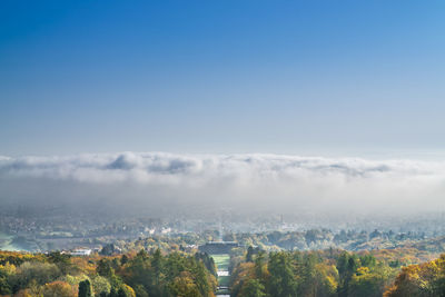 Aerial view of landscape against blue sky