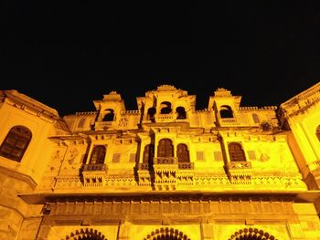 Low angle view of historical building at night