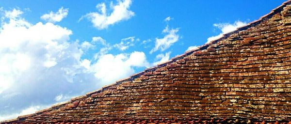 Low angle view of building against blue sky