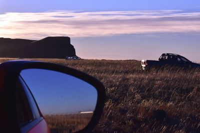 Scenic view of sunset seen through car windshield