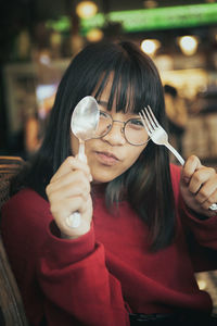 Portrait of woman holding ice cream