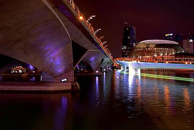 Reflection of illuminated buildings in water at night