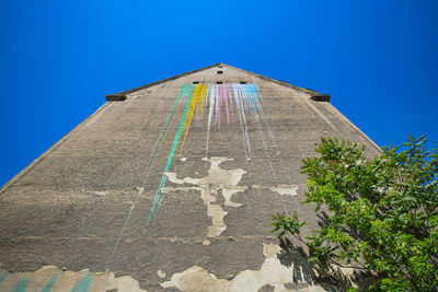 Low angle view of building against blue sky