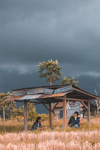 Built structure on field against sky