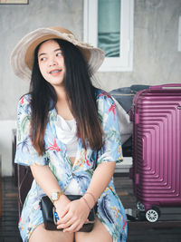 Travel concept from young asian woman in summer clothes smiling cheerful and happy.