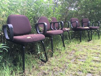 Empty chairs on field