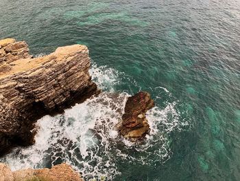 High angle view of rock in sea