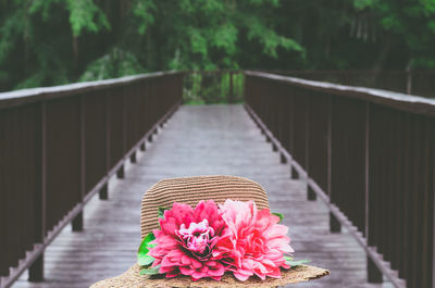 Close-up of hat on bridge