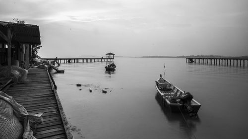 Pier over sea against sky