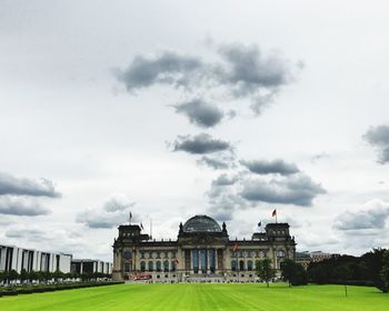 View of government building against cloudy sky