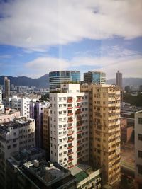 High angle view of buildings in city against sky