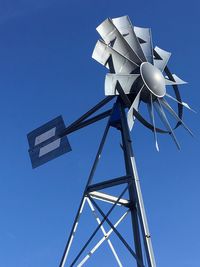 Low angle view of american-style windmill against sky