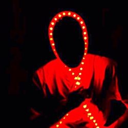 Close-up of light bulb over black background