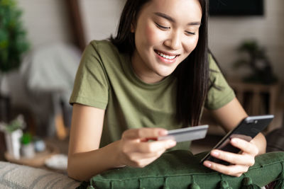 Young woman using mobile phone