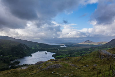 Scenic view of landscape and mountains against sky