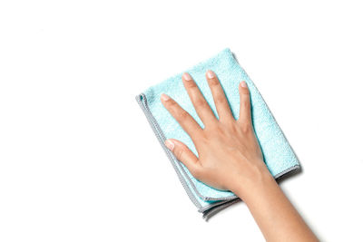 Close-up of woman hand against white background