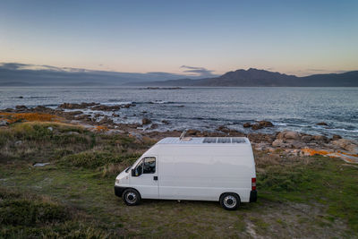 Camper van motorhome with solar panels drone aerial view living van life in galiza, spain