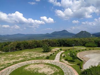 High angle view of green landscape against sky