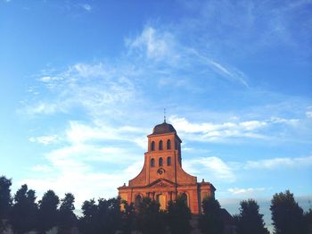 Low angle view of church against cloudy sky