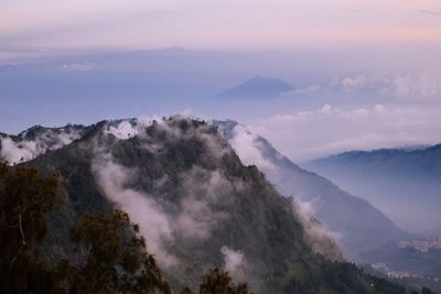 Scenic view of mountains against sky during sunset