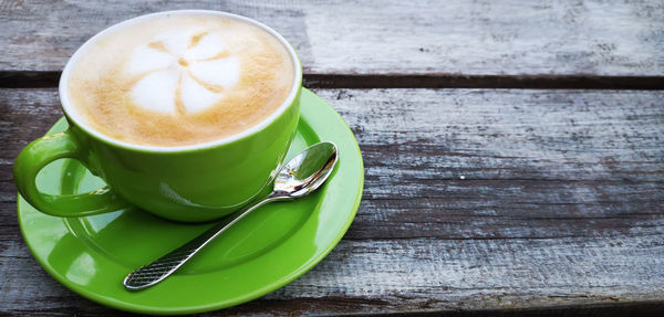 High angle view of coffee cup on table