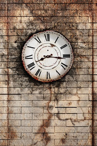 Close-up of clock on wall