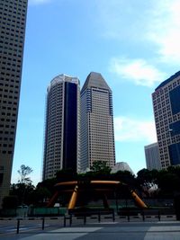 Low angle view of modern buildings against sky