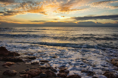 Scenic view of sea against sky during sunset