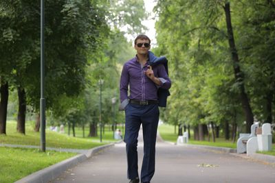 Portrait of man standing on road