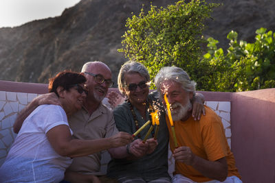 Rear view of people sitting outdoors