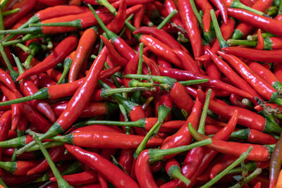 Full frame shot of red chili peppers for sale at market